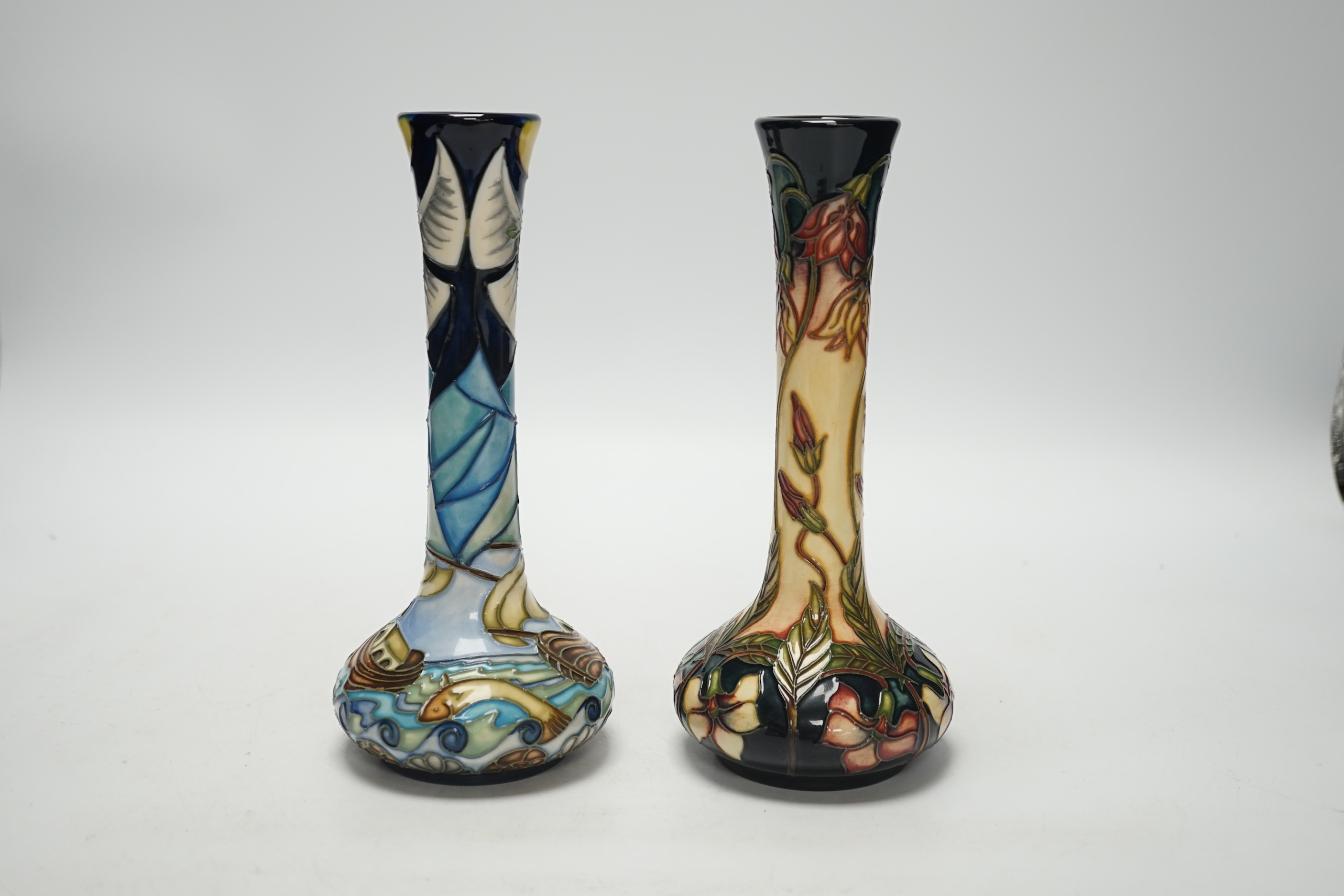 A Moorcroft ‘Winds of Change’ bottle vase, designed by Rachel Bishop, together with another vase by G Bishop, tallest 21cm